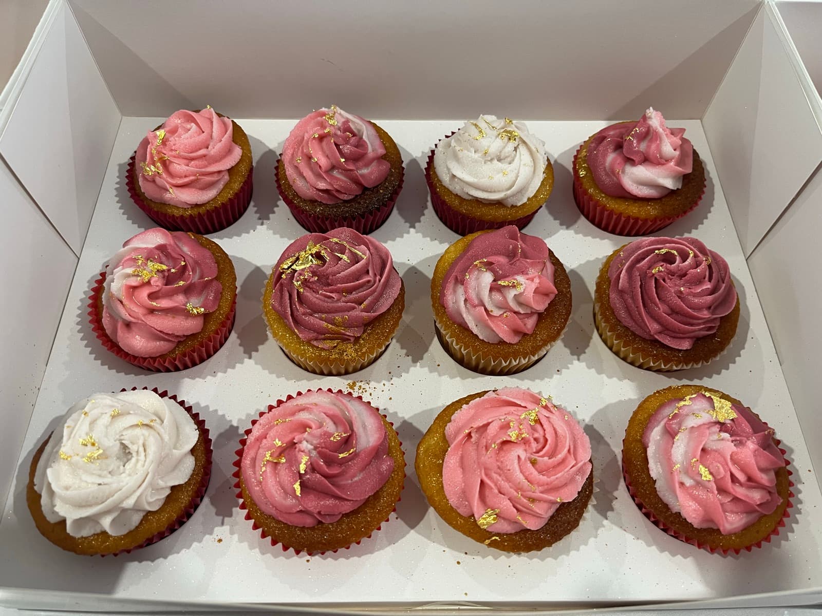 Assorted cupcakes with milk and white chocolate toppers