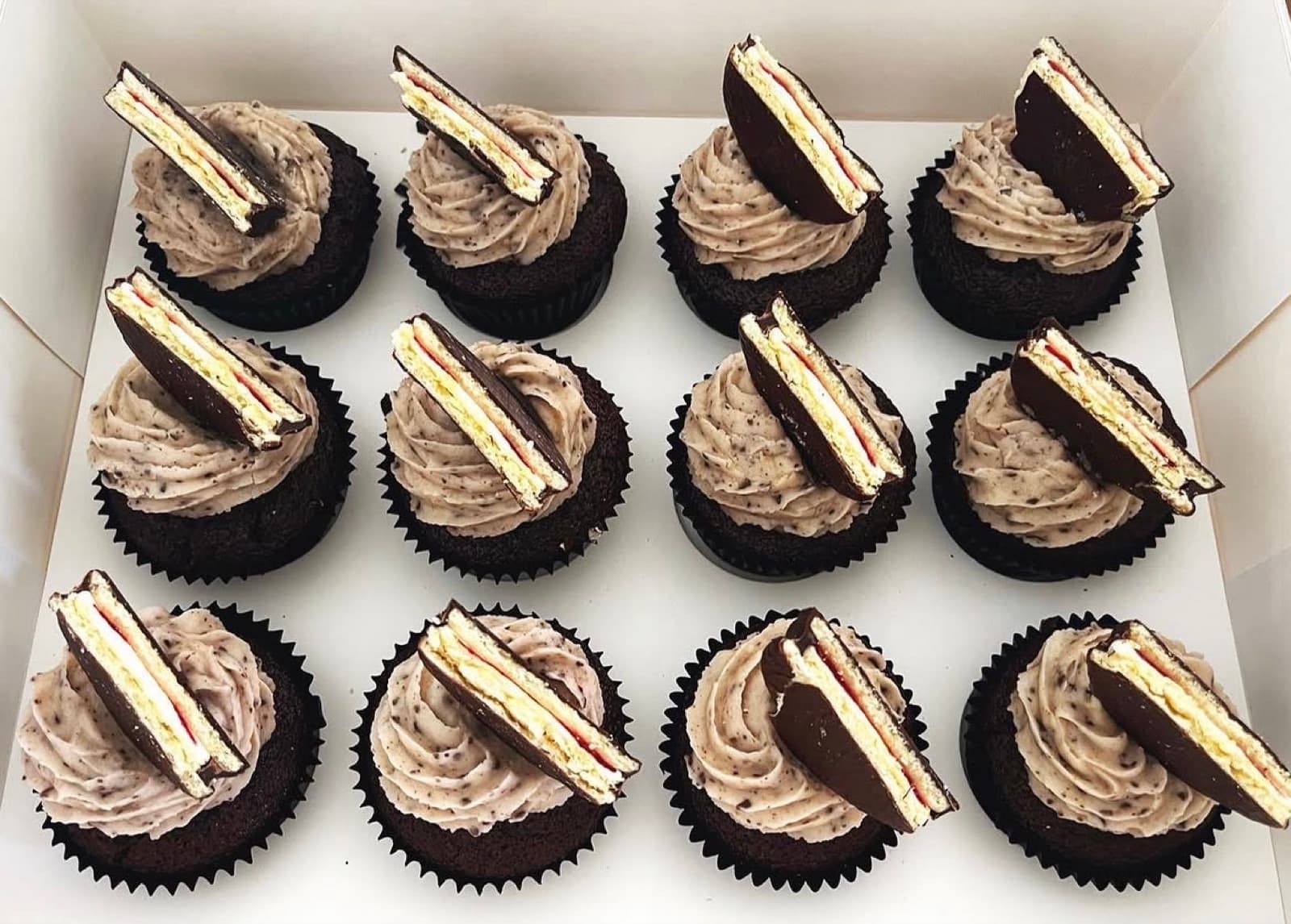 Chocolate cupcakes with cookies-and-cream frosting and wafer toppers
