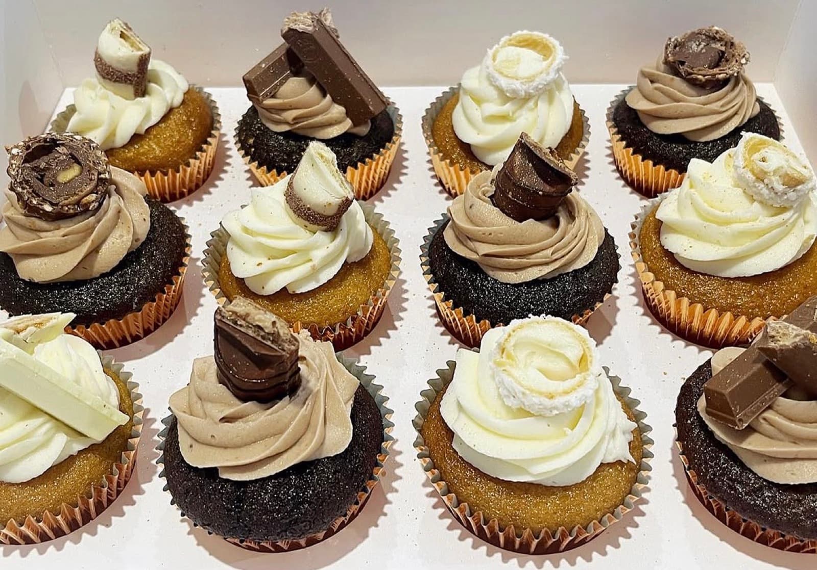 Vanilla and chocolate cupcakes topped with Kinder Bueno