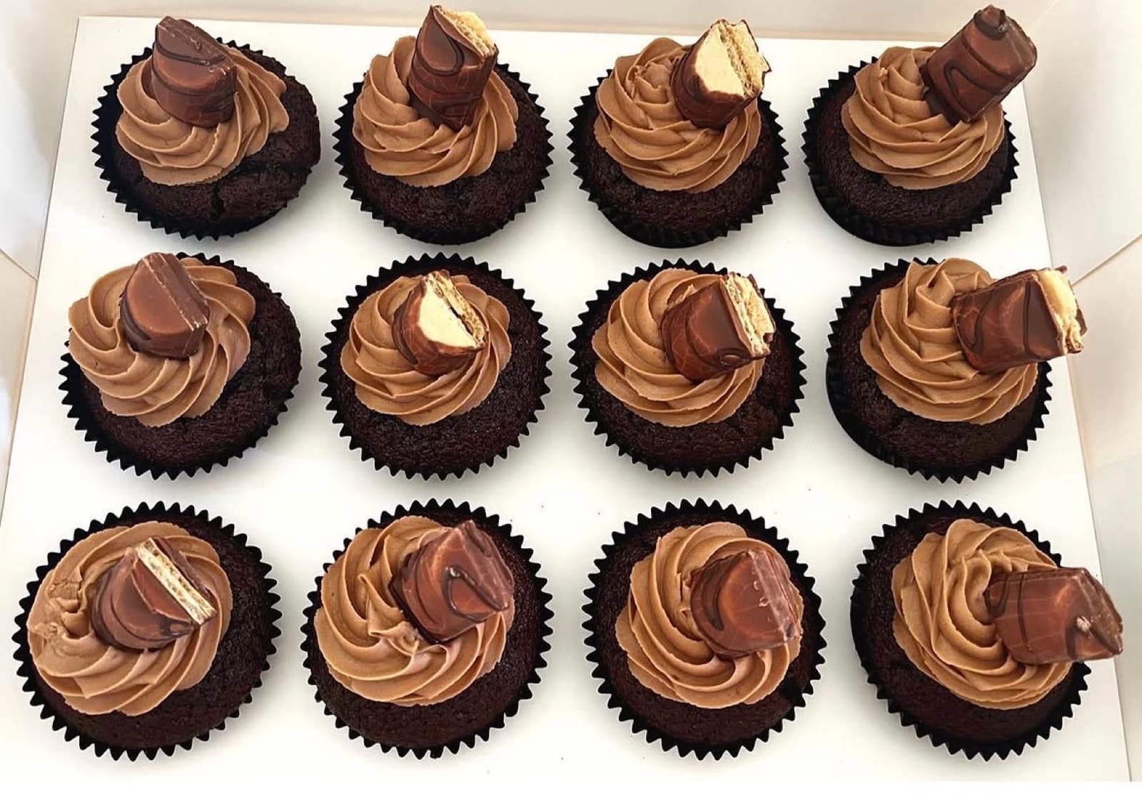 Chocolate cupcakes with mocha frosting and Kinder chocolate