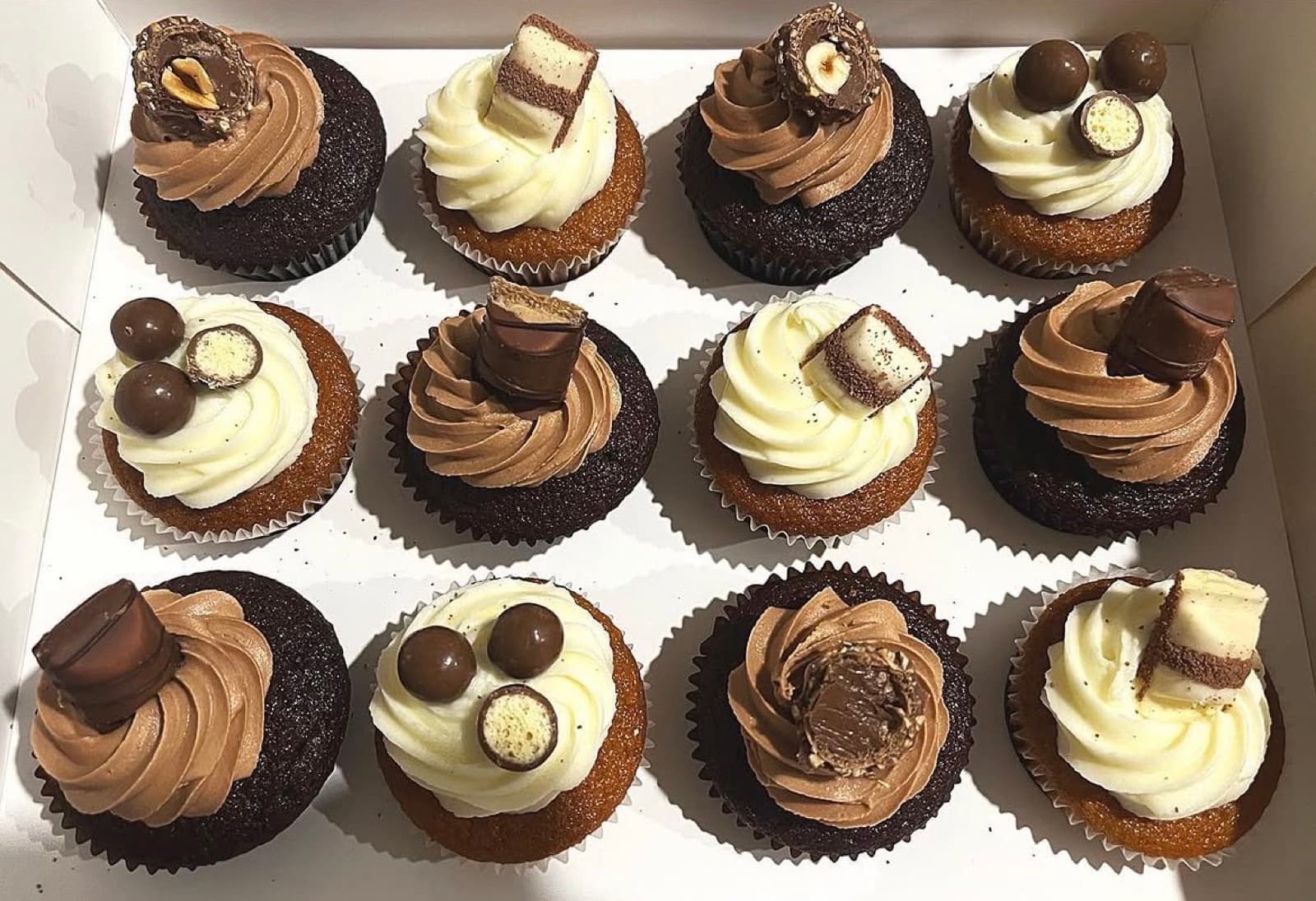 Chocolate and vanilla cupcakes with Kinder and Ferrero toppers