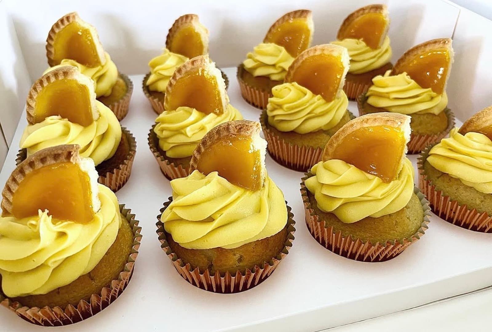 Lemon cupcakes with yellow buttercream and a lemon curd centre