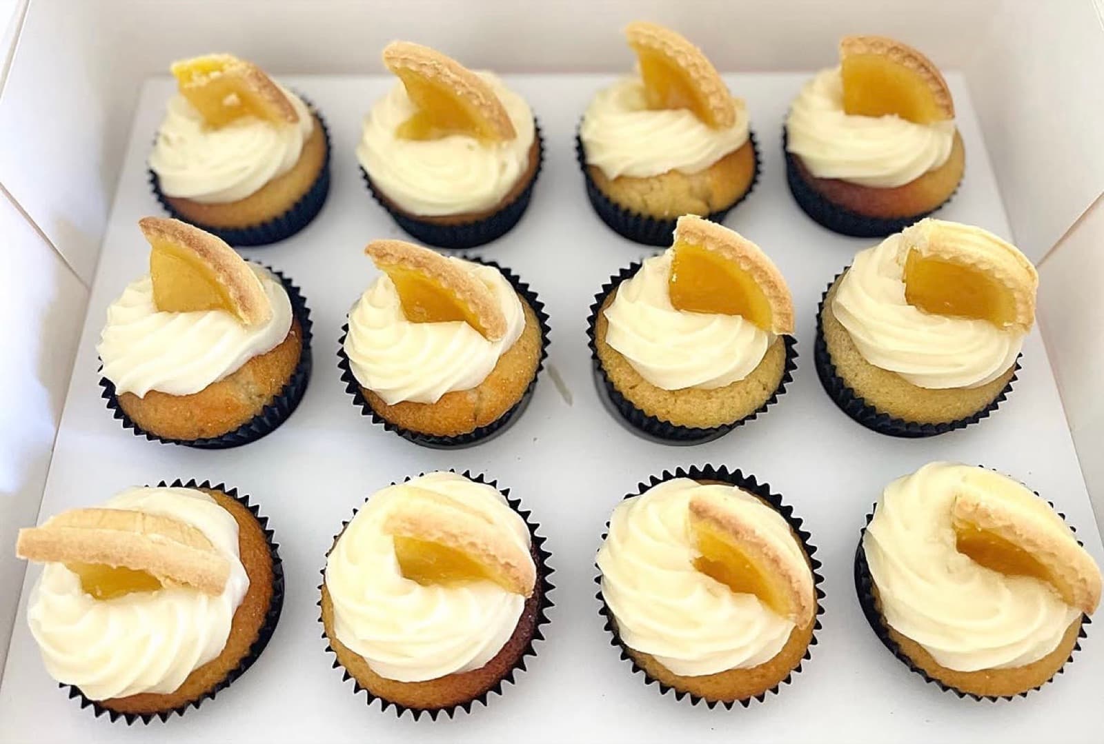 Vanilla cupcakes with lemon buttercream and a shortbread wedge