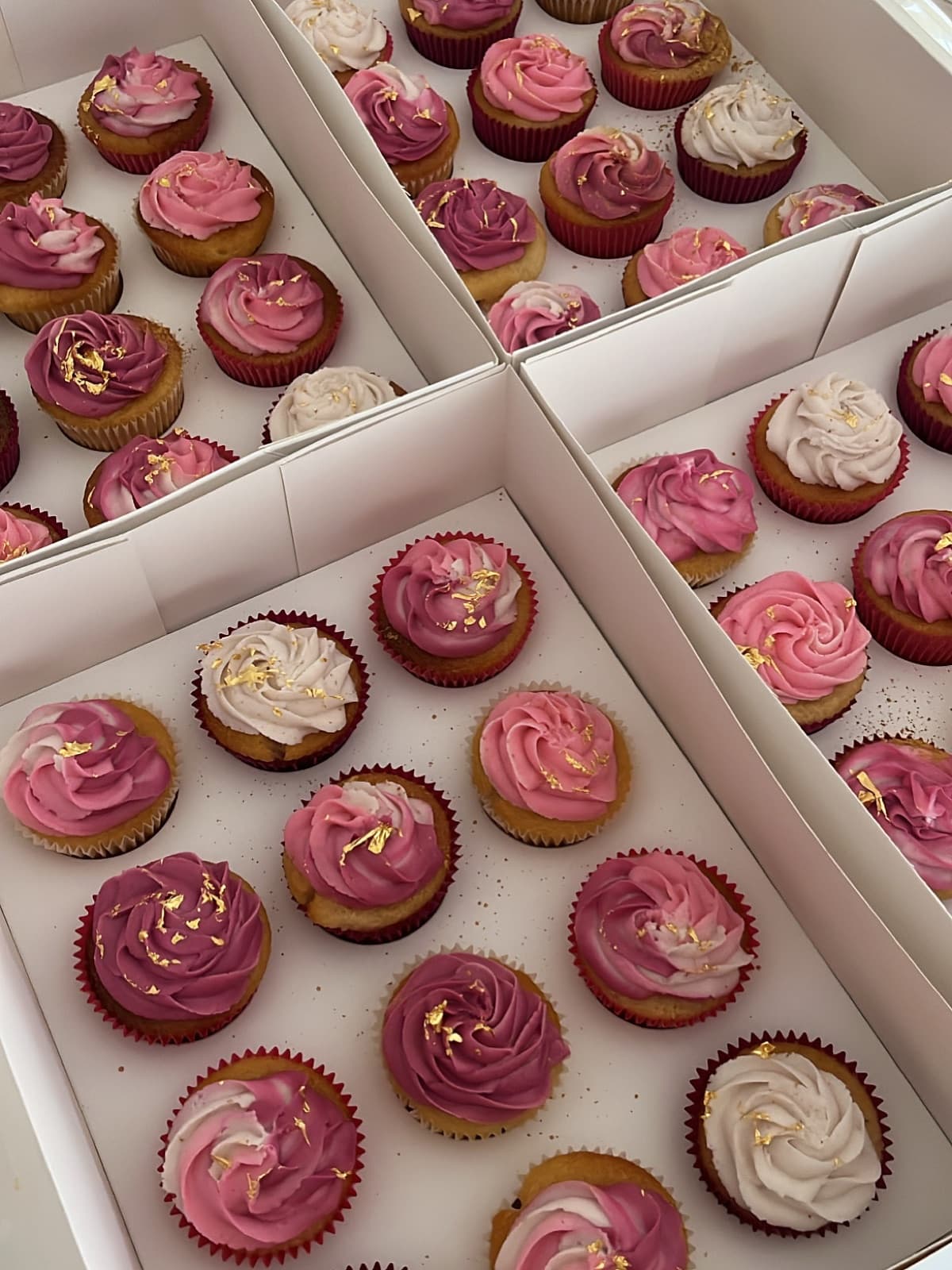 Magenta and cream cupcakes flecked with edible gold leaf