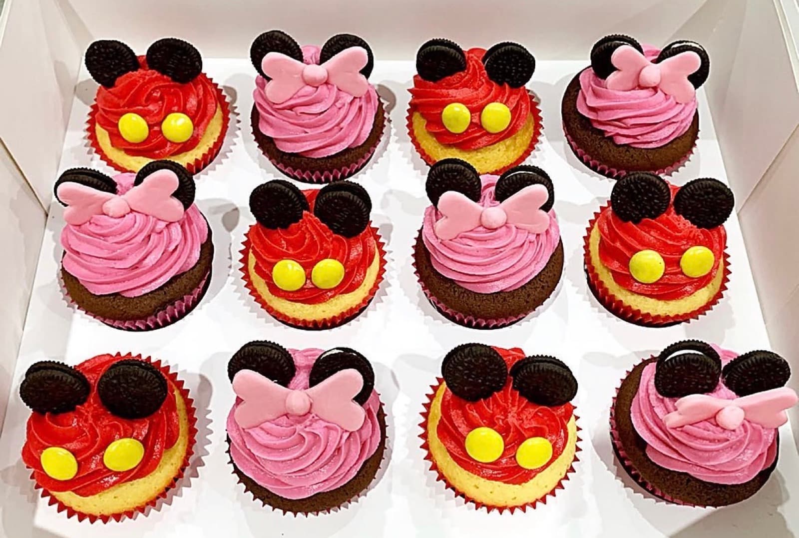 Minnie and Mickey Mouse cupcakes with Oreo ears and fondant bows