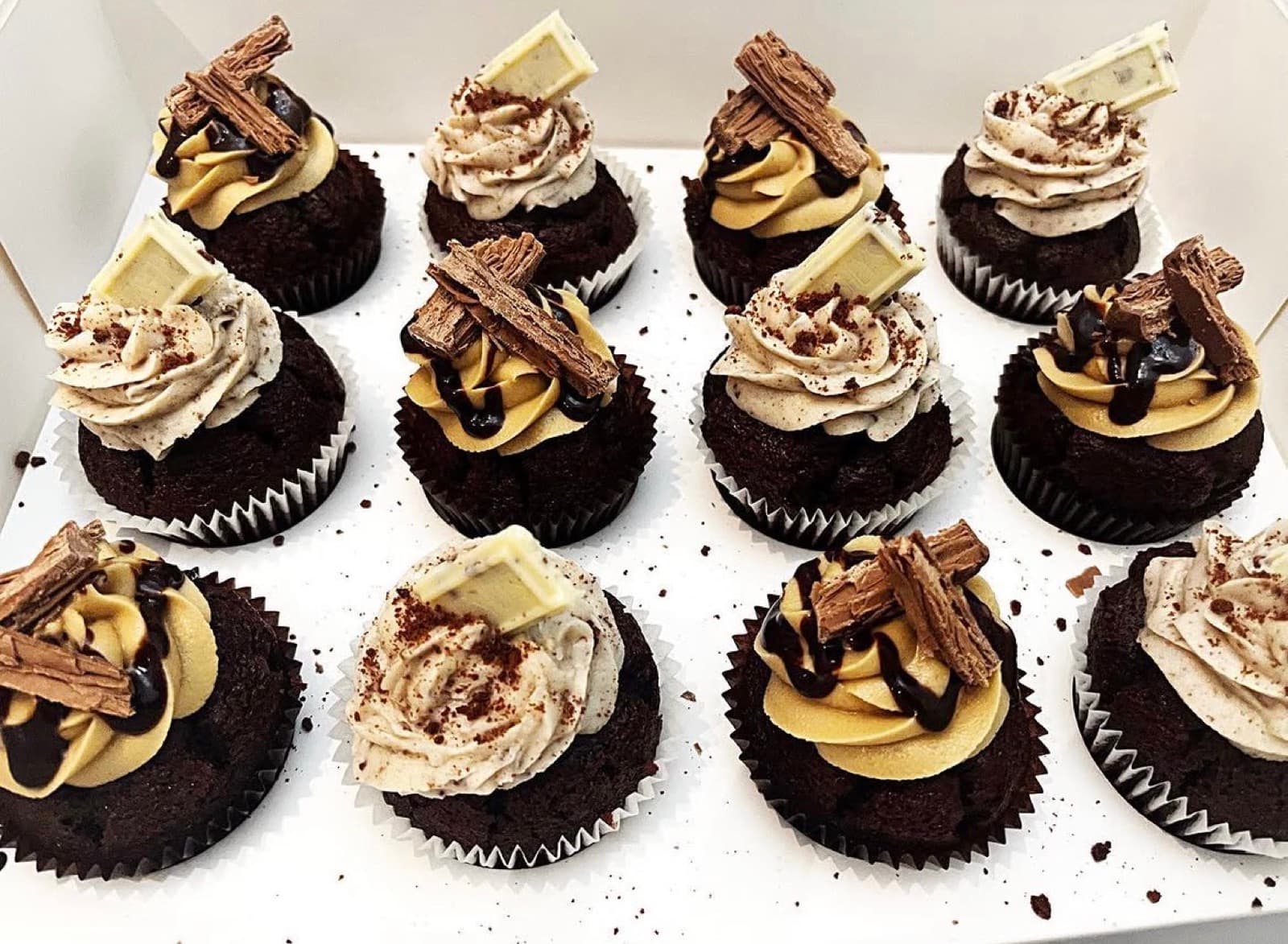 Chocolate cupcakes with mocha frosting, Flake and white chocolate
