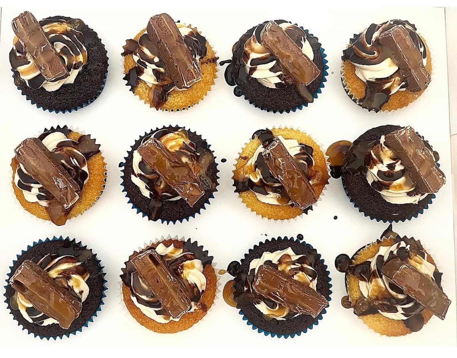 Chocolate cupcakes with caramel swirl and Twix pieces